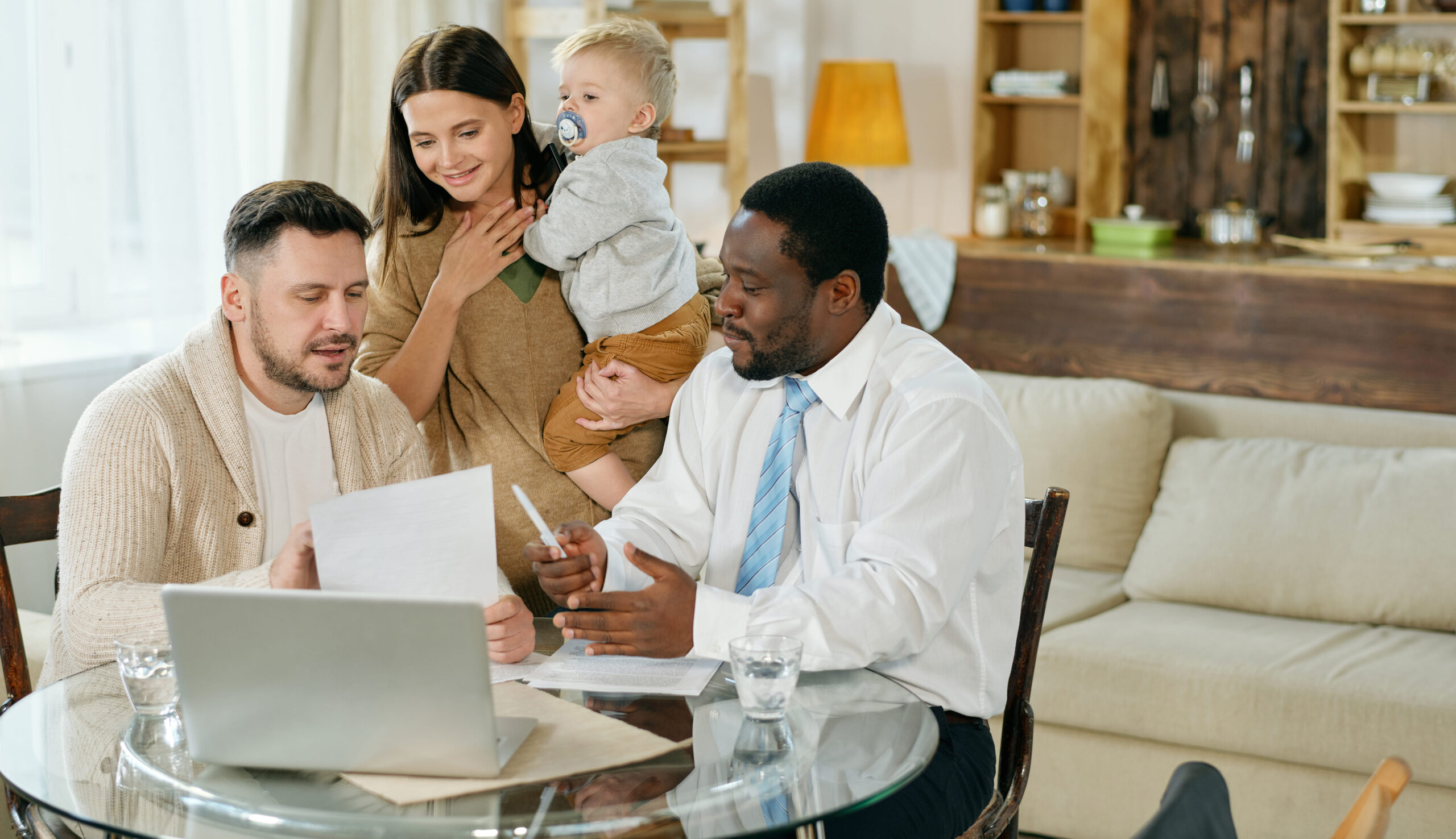 man visiting family at home giving consultation