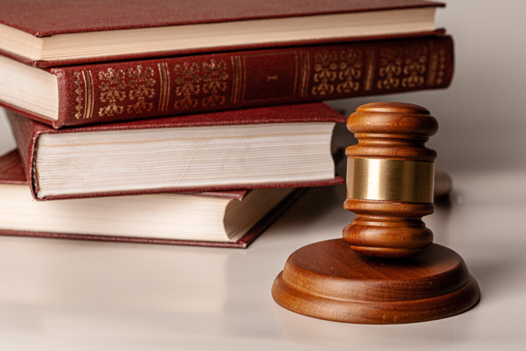 Gavel and legal books, symbolizing the impact of paternity on legal decisions.