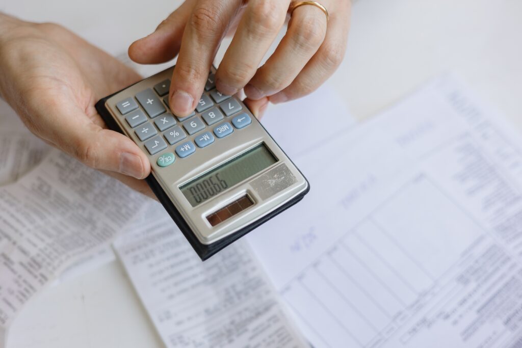 Calculator and financial documents used for calculating alimony.